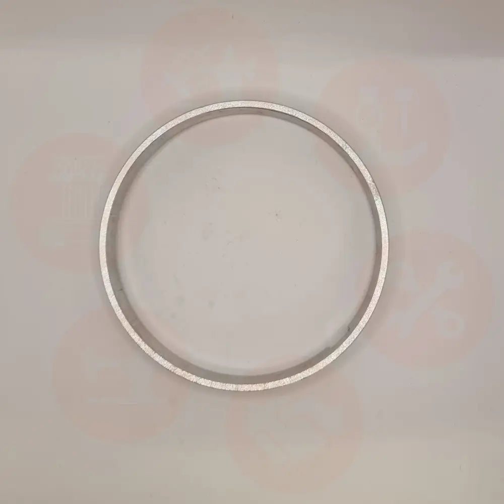 Silver ring on a light gray background