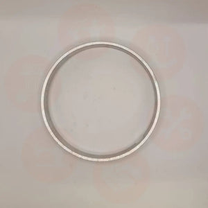 Silver ring on a light gray background