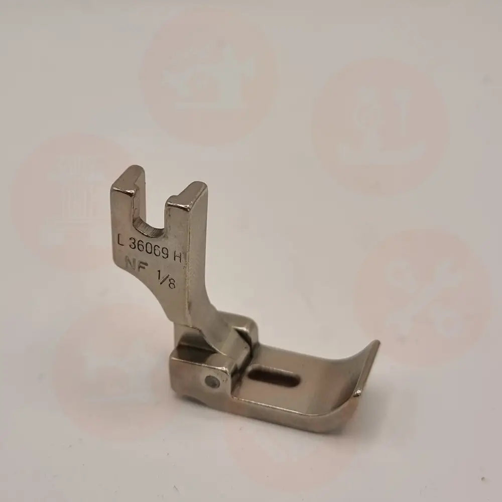L36069HNFX1/8=3MM NEEDLE FEED PIPING FOOT LEFT INDUSTRIAL FEET
